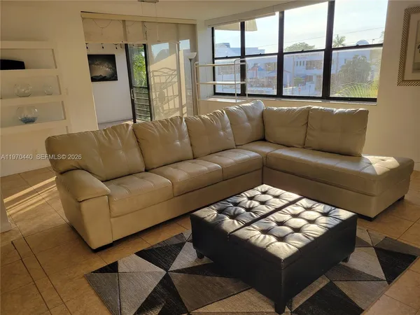 a living room with furniture and a window