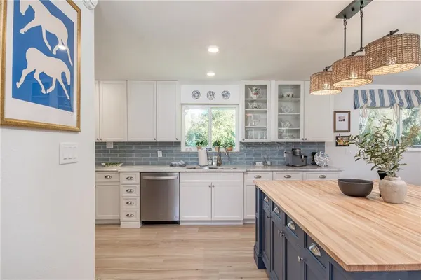 a kitchen with a sink and cabinets