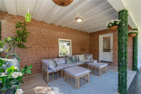 a outdoor living space with furniture and a potted plant