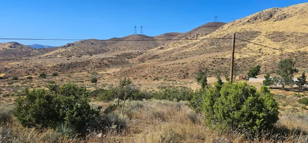 a view of a large building with a mountain in the background