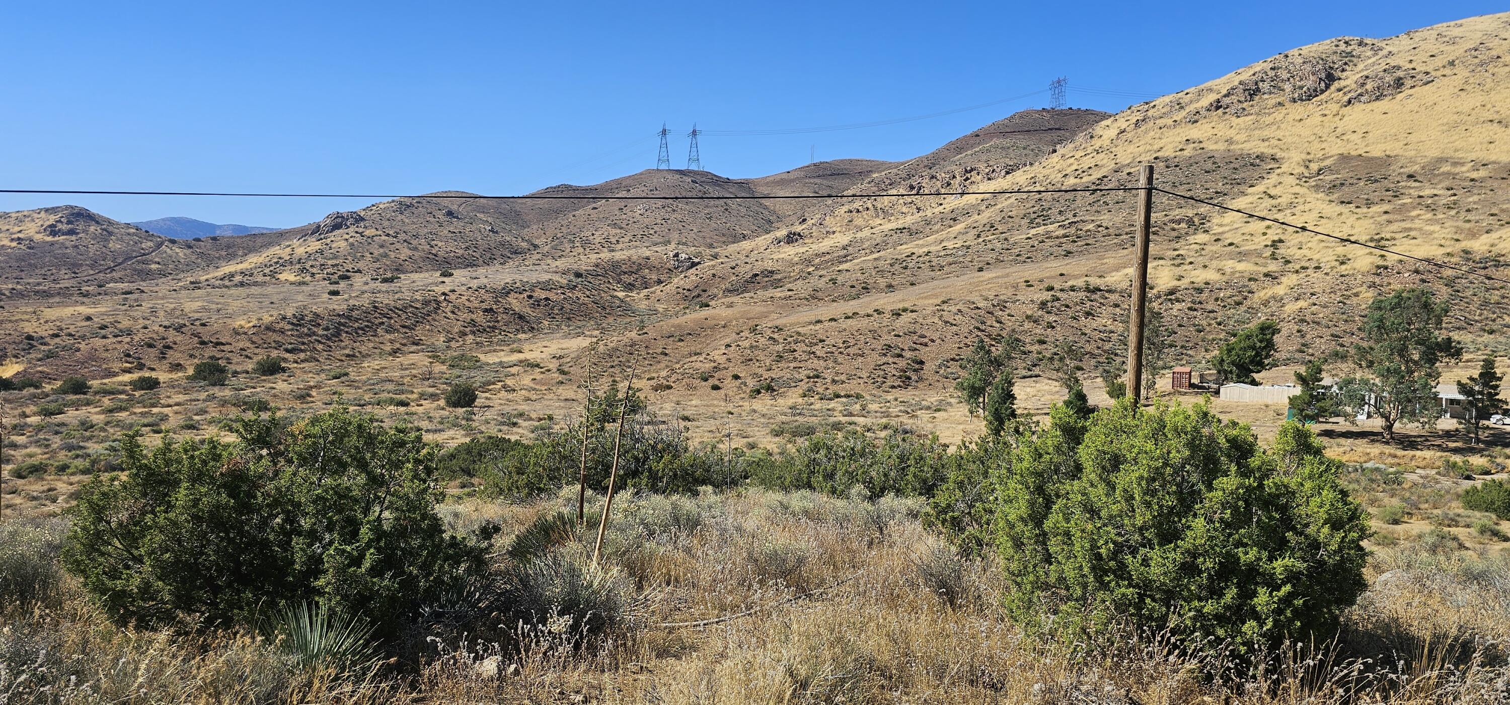 Soledad Pass Palmdale, CA 93550 - Photo 3 of 9 a view of a large building with a mountain in the background