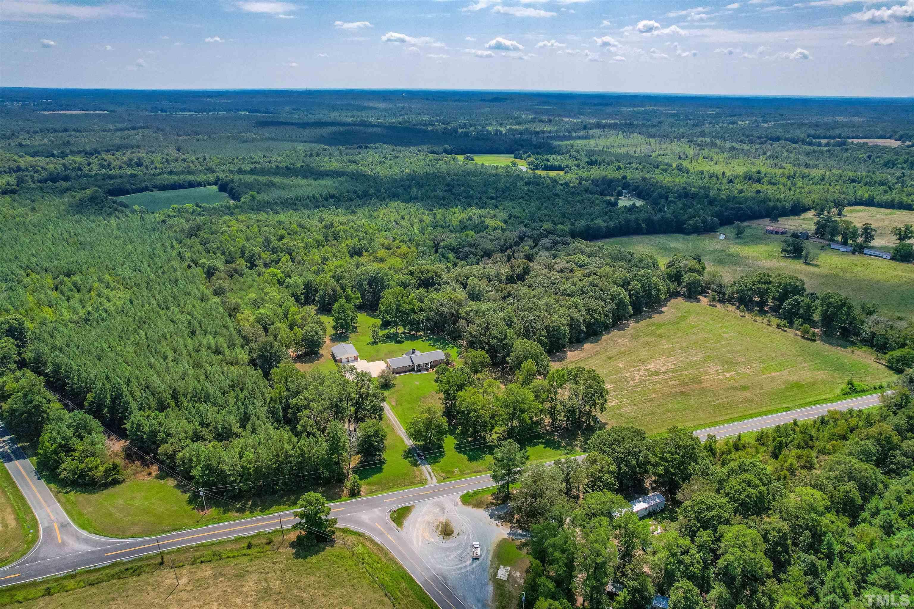 0 Bennett Siler City Road Bennett, NC 27208 - Photo 2 of 12 an aerial view of residential houses with outdoor space and trees