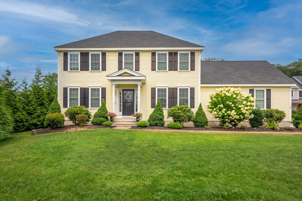 4 Rhodes Drive, Unit 4 Berlin, MA 01503 - Photo 1 of 30 a front view of a house with a yard
