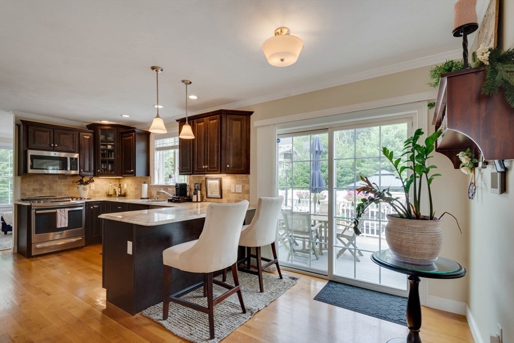 4 Rhodes Drive, Unit 4 Berlin, MA 01503 - Photo 12 of 30 a view of a dining room with furniture window and wooden floor