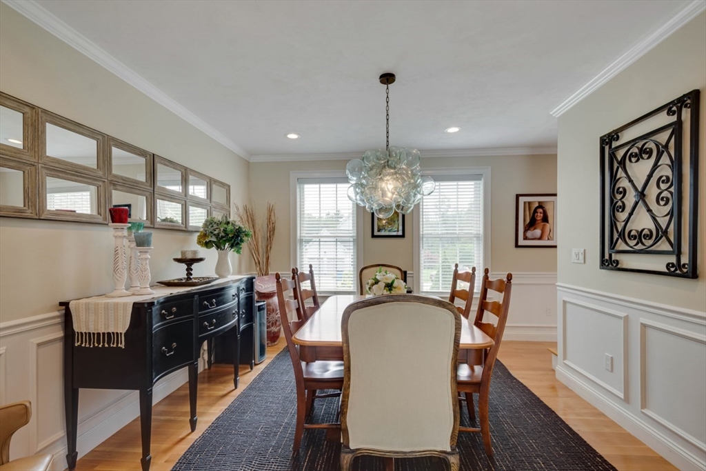 4 Rhodes Drive, Unit 4 Berlin, MA 01503 - Photo 13 of 30 a view of a dining room with furniture a chandelier and wooden floor