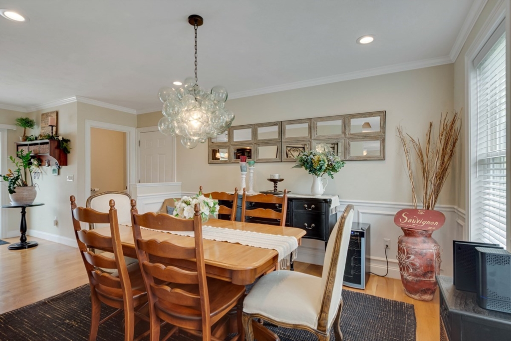 4 Rhodes Drive, Unit 4 Berlin, MA 01503 - Photo 14 of 30 a view of a dining room with furniture and wooden floor