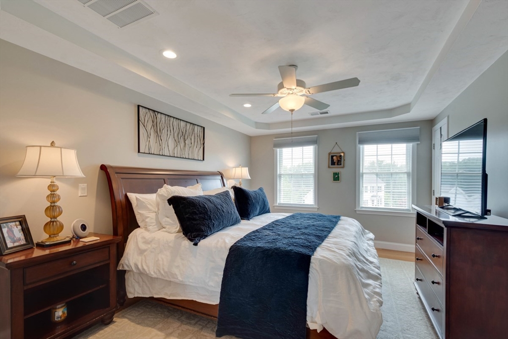 4 Rhodes Drive, Unit 4 Berlin, MA 01503 - Photo 17 of 30 a bedroom with a large bed and a window