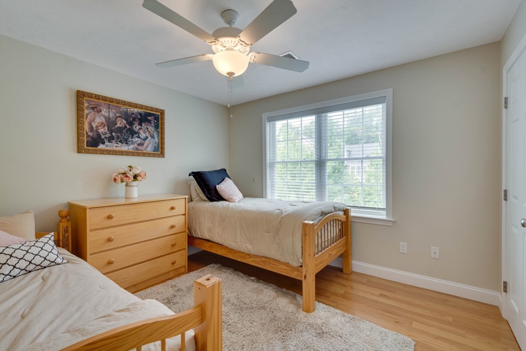 4 Rhodes Drive, Unit 4 Berlin, MA 01503 - Photo 20 of 30 a bed room with a bed and a window