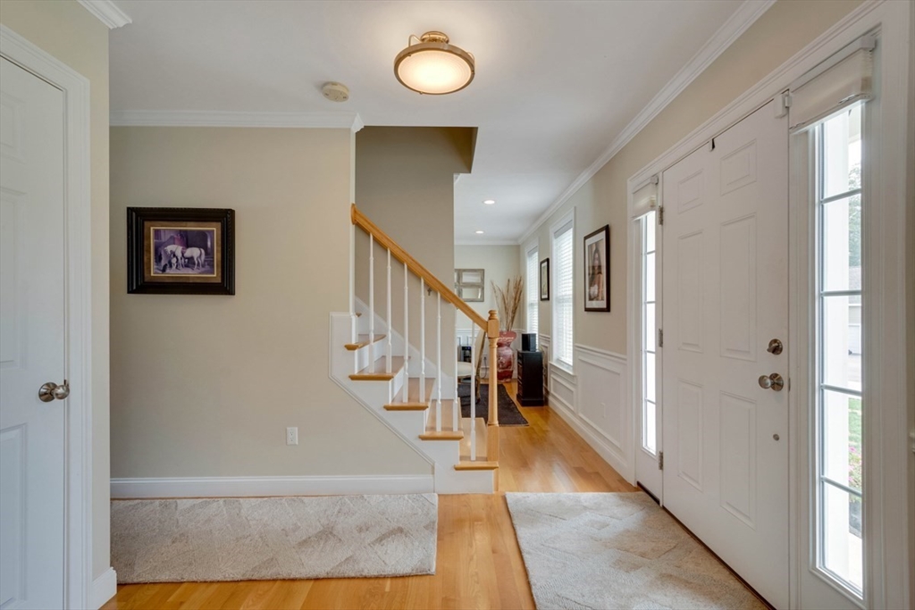 4 Rhodes Drive, Unit 4 Berlin, MA 01503 - Photo 2 of 30 a view of entryway and hall with wooden floor