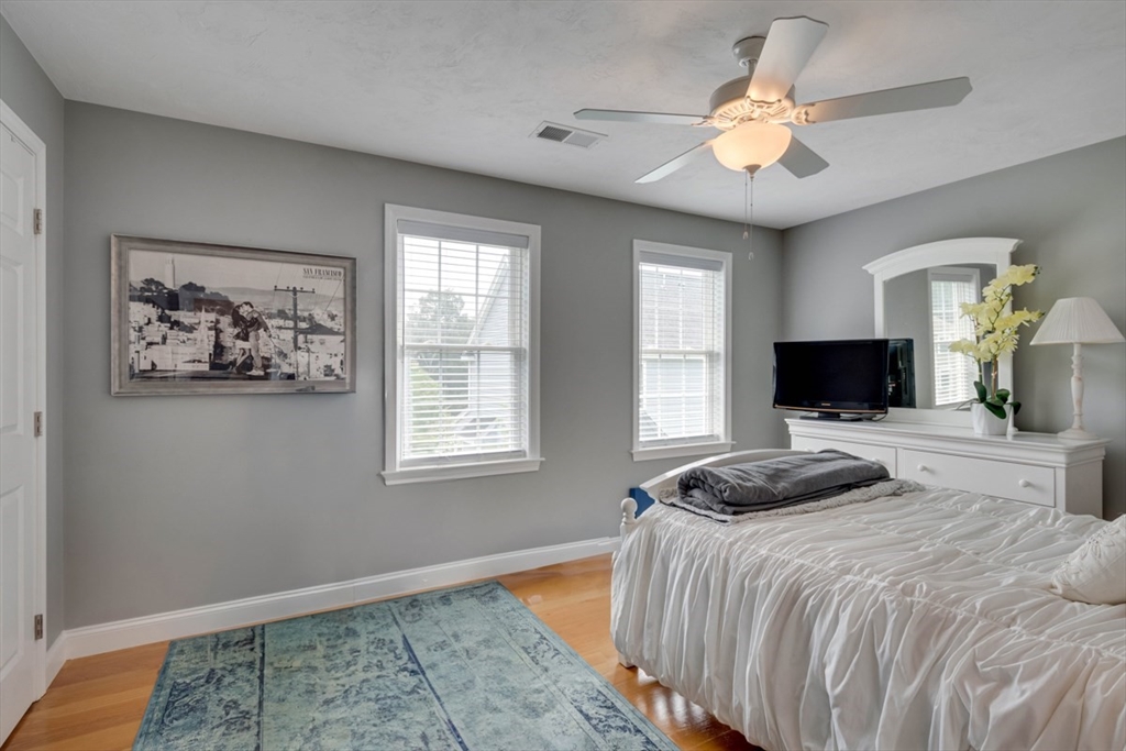 4 Rhodes Drive, Unit 4 Berlin, MA 01503 - Photo 22 of 30 a bedroom with a bed and a flat screen tv