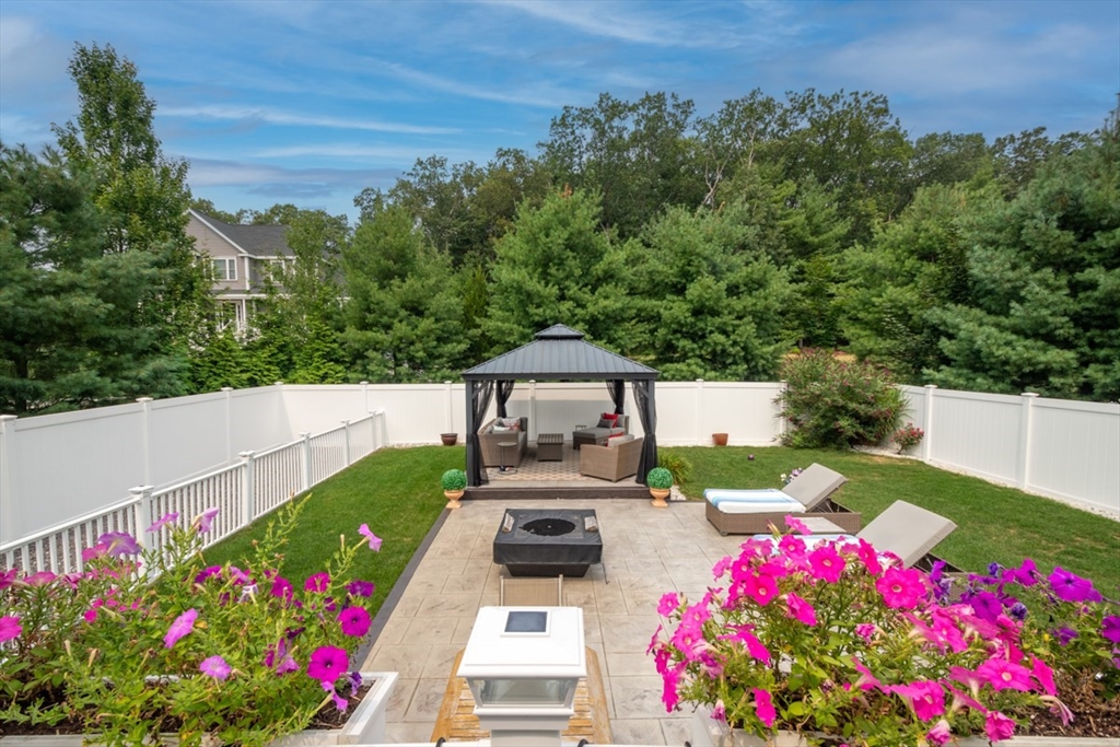 4 Rhodes Drive, Unit 4 Berlin, MA 01503 - Photo 27 of 30 a view of a garden with flowers
