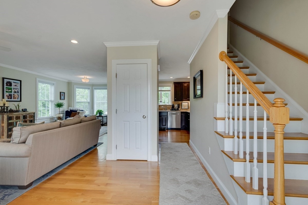 4 Rhodes Drive, Unit 4 Berlin, MA 01503 - Photo 3 of 30 a living room with furniture and a wooden floor