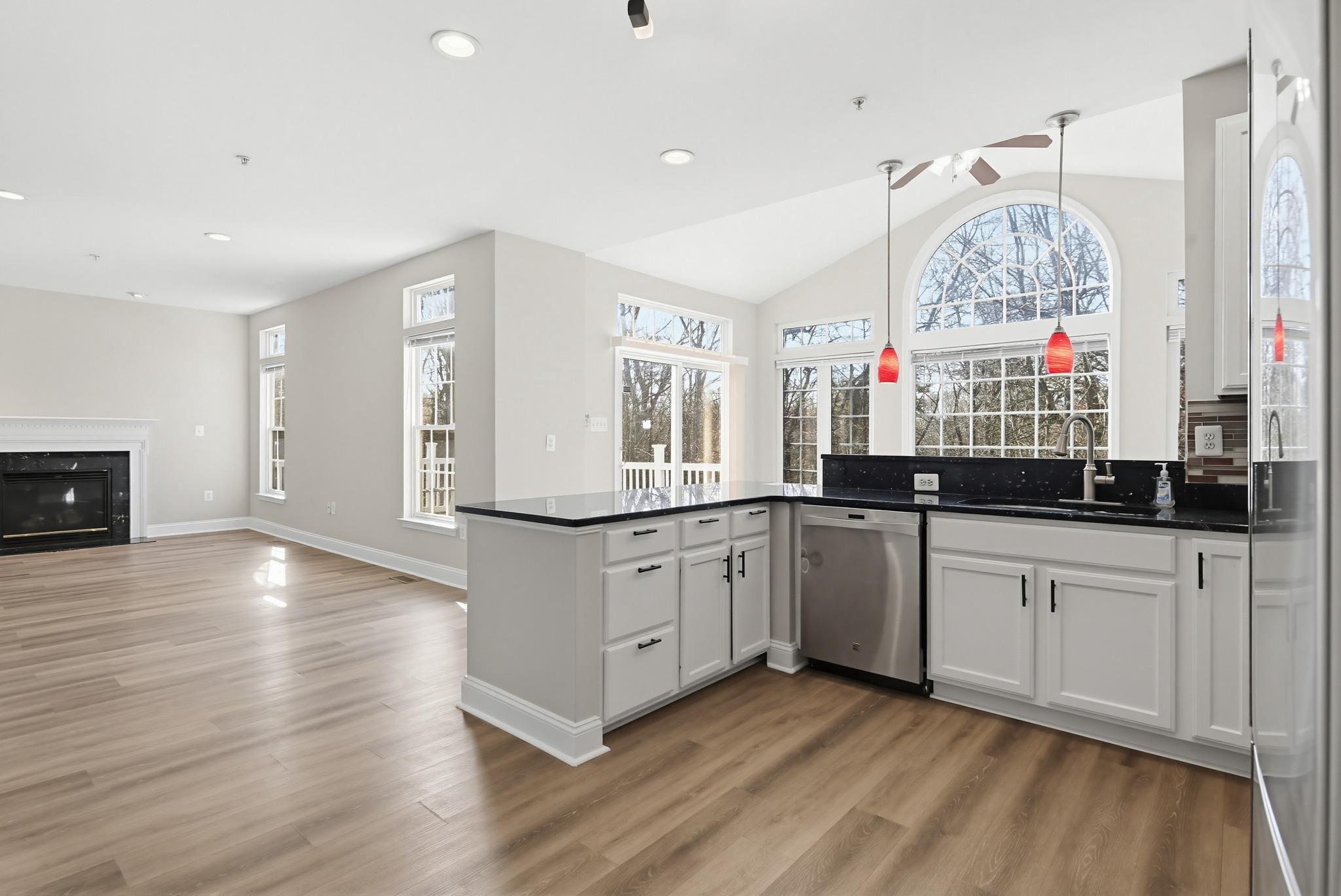 14603 Farnham Lane Laurel, MD 20707 - Photo 16 of 51 Views to family room and sunroom from kitchen