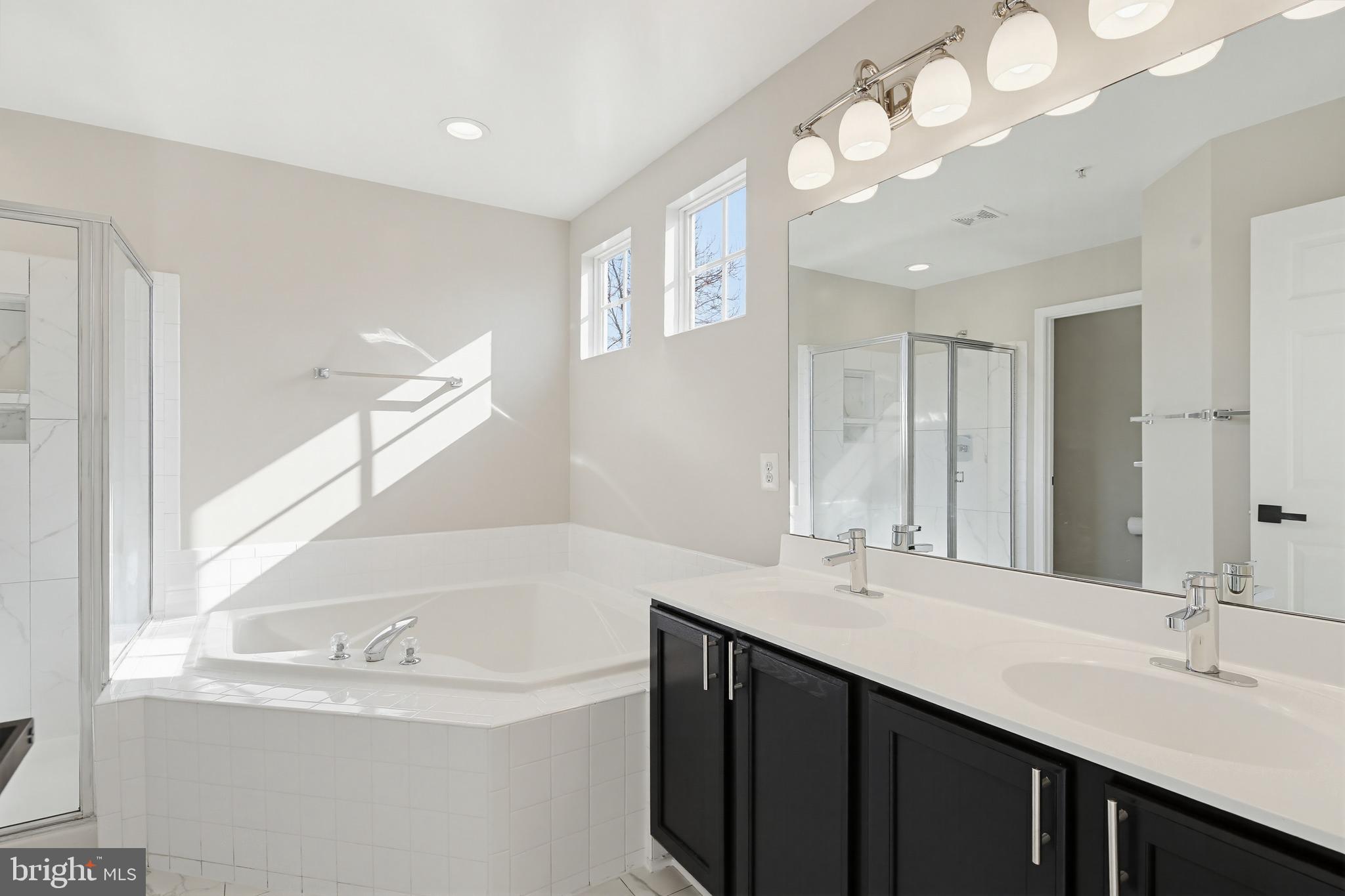 14603 Farnham Lane Laurel, MD 20707 - Photo 33 of 51 Primary ensuite bathroom - tile floor & shower