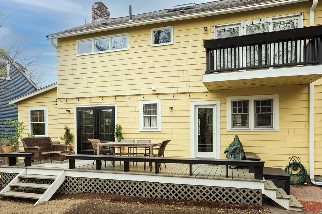 170 Oliver Road Newton, MA 02468 - Photo 11 of 13 a view of a house with a wooden bench