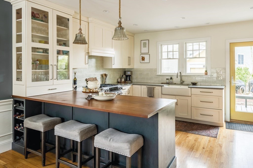 170 Oliver Road Newton, MA 02468 - Photo 5 of 13 a kitchen with a table chairs sink and cabinets