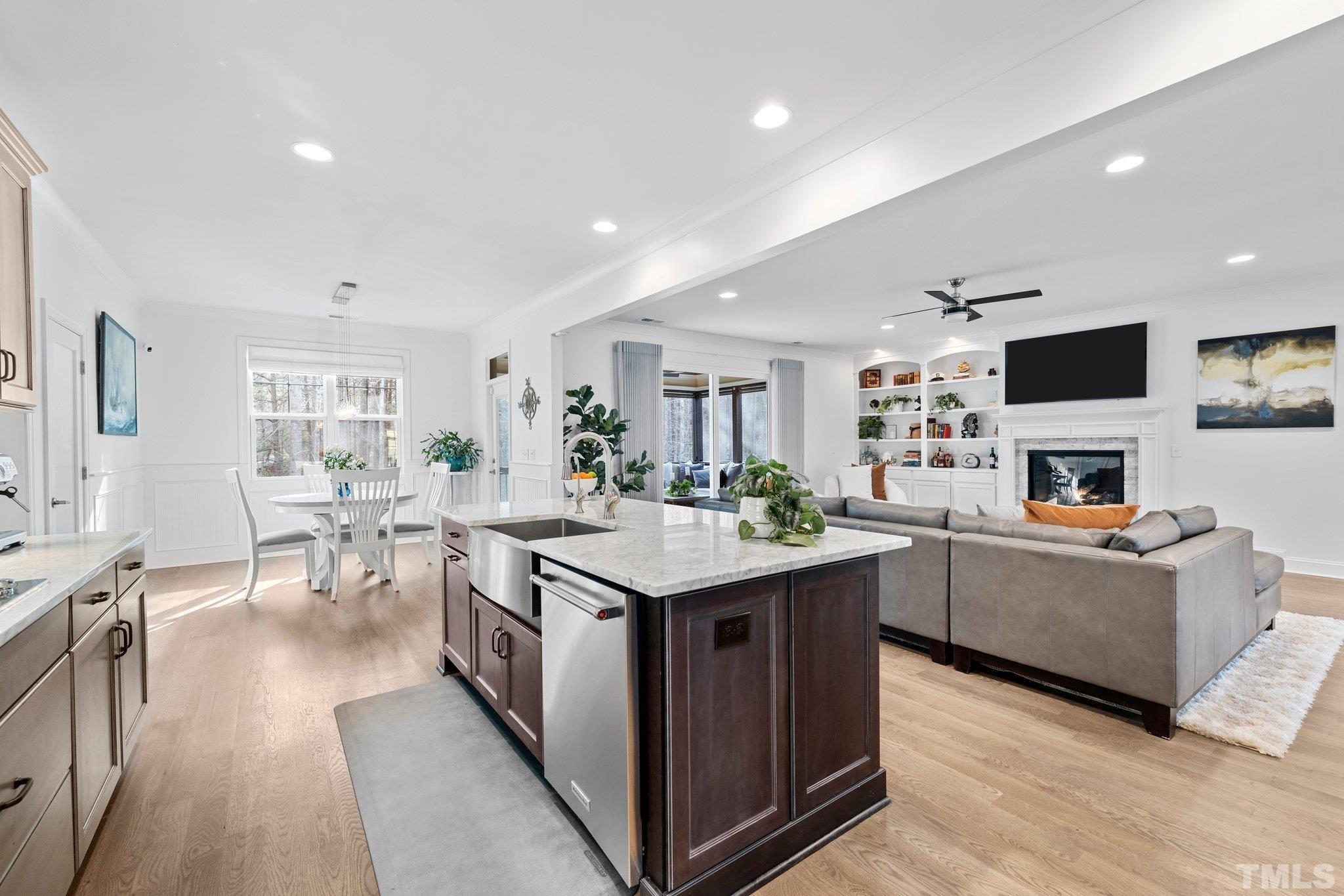 9508 Oakhurst Court Raleigh, NC 27614 - Photo 18 of 67 Beautiful kitchen with: Carrera marble countertops, gas cooktop, farm house sink, soft close drawers, spacious pantry, French linen shade, & under cabinet lighting.