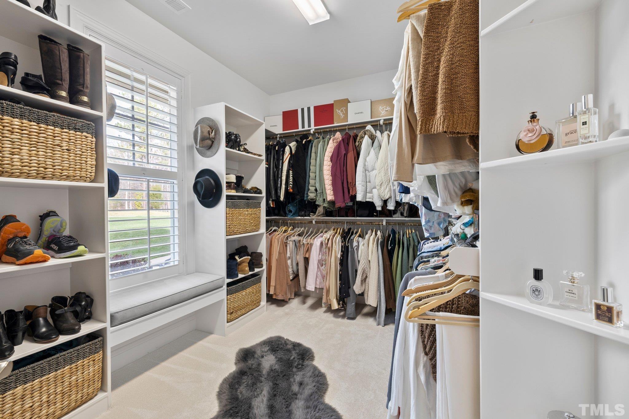 9508 Oakhurst Court Raleigh, NC 27614 - Photo 31 of 67 Spacious closet with custom wood shelving.