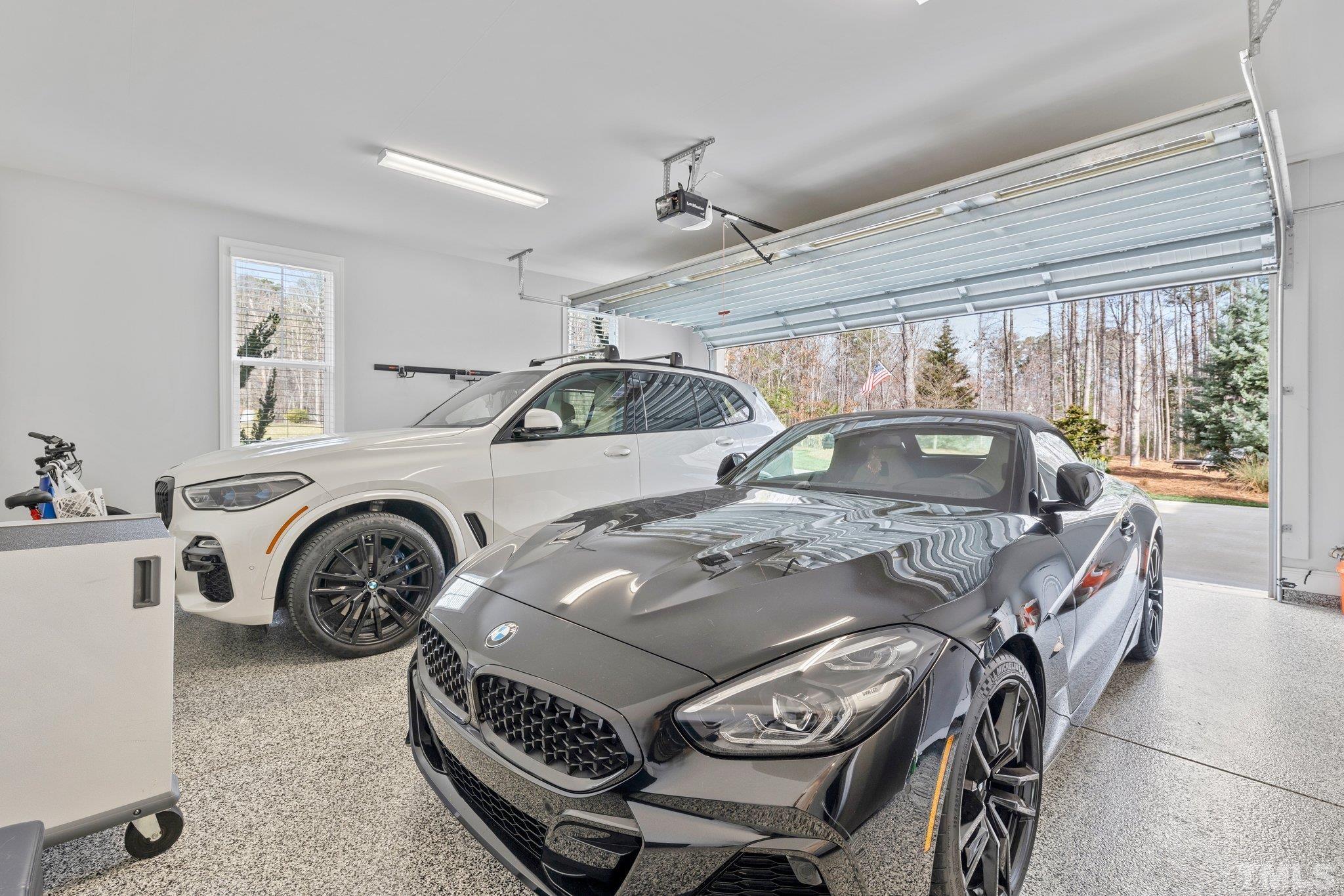 9508 Oakhurst Court Raleigh, NC 27614 - Photo 42 of 67 Don't forget the 3rd car garage which could be a great workshop or a great place for your extra toys. Both garages completely finished with epoxy flooring, baseboards, trim, painted walls, & blinds.