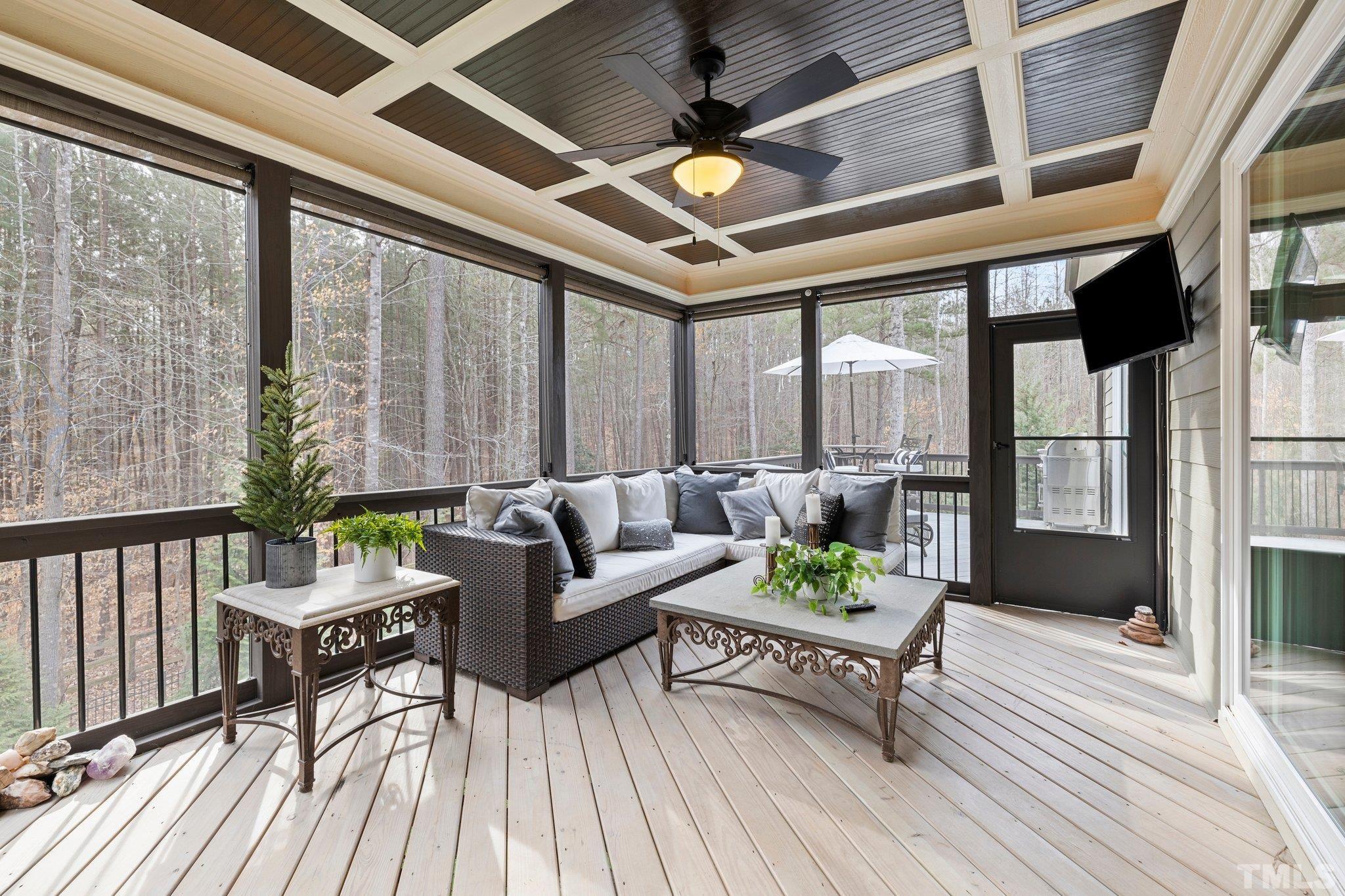 9508 Oakhurst Court Raleigh, NC 27614 - Photo 43 of 67 Spacious screened in porch with installed TV opens up via sliding doors from family room nearly doubling living space.