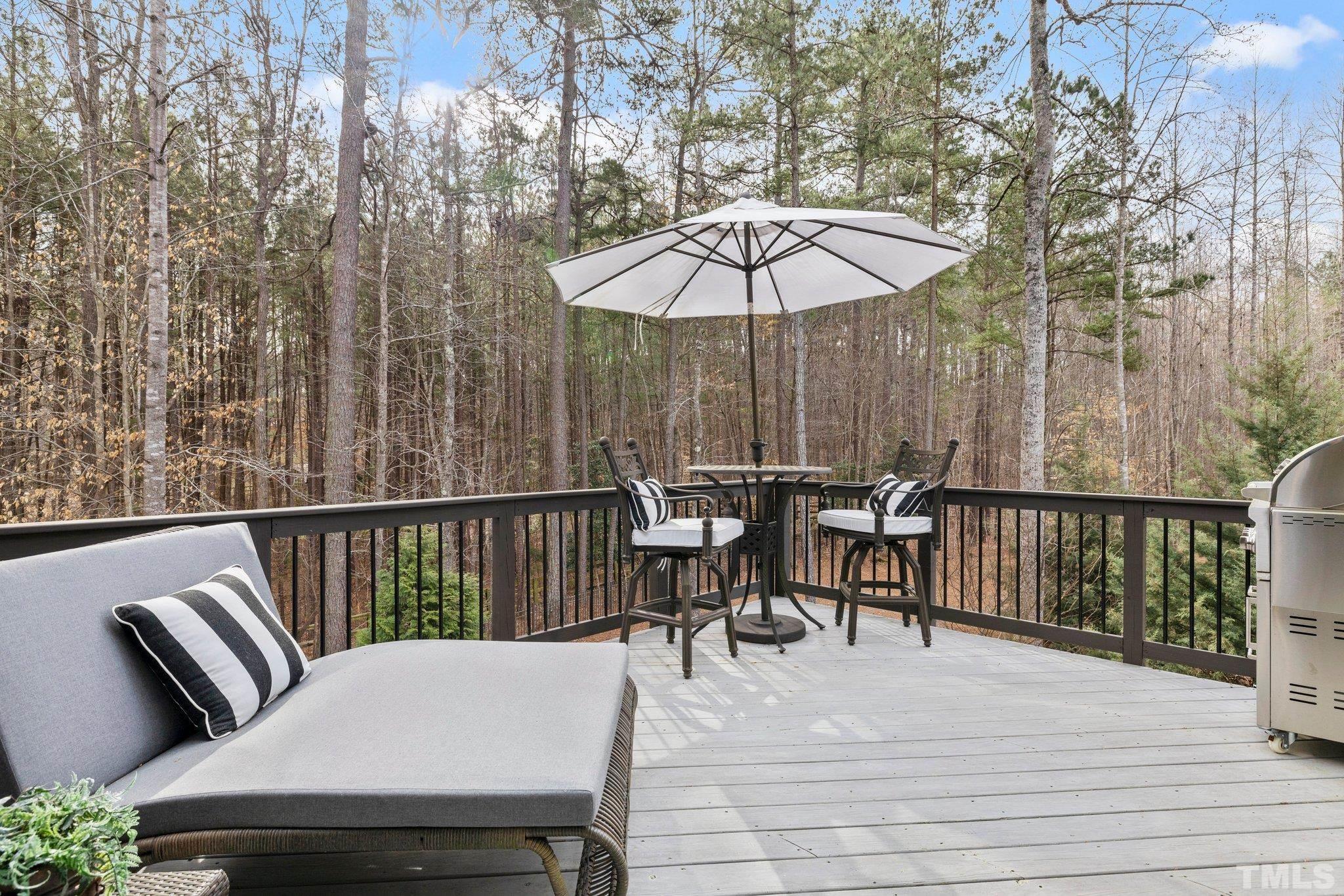 9508 Oakhurst Court Raleigh, NC 27614 - Photo 44 of 67 Spacious open air deck opens up via sliding doors from owner's suite with views of private wooded backyard.
