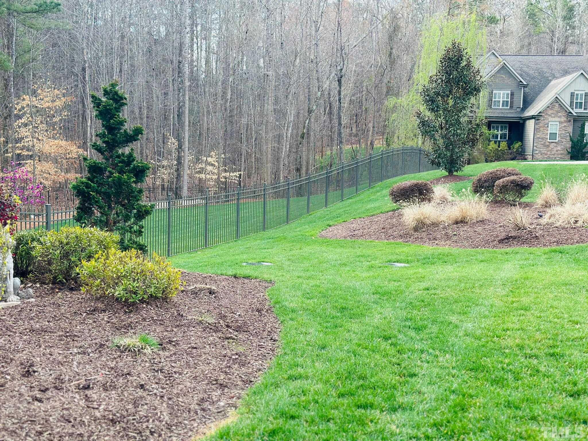 9508 Oakhurst Court Raleigh, NC 27614 - Photo 52 of 67 Fenced with beautiful metal fencing with three gated openings.