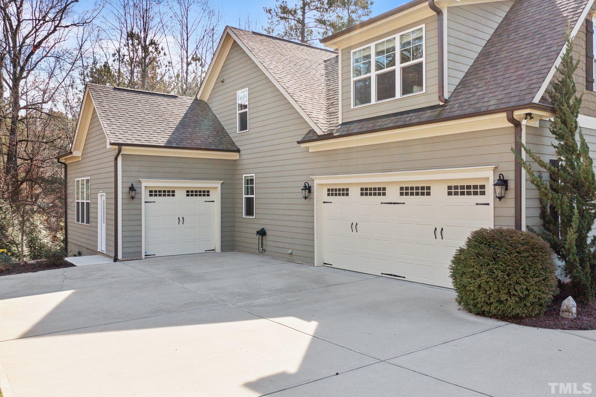 9508 Oakhurst Court Raleigh, NC 27614 - Photo 8 of 67 Great 2 car garage and a 3rd car garage that could be used for additional toys or as a great workshop. Both with completely epoxy flooring, baseboards, trim, painted walls, & blinds