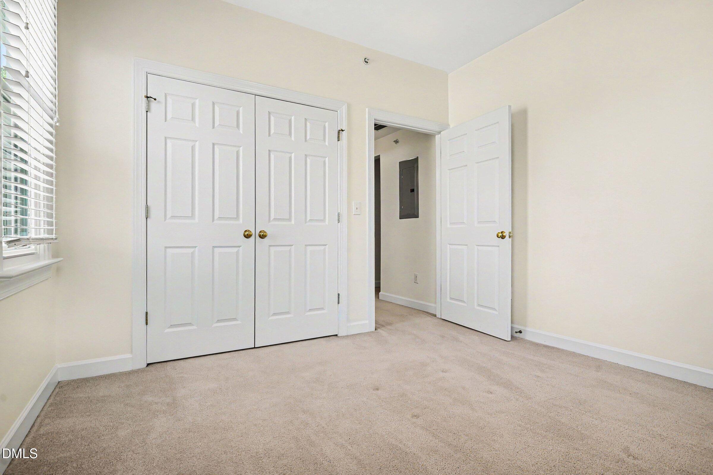 2651 Mellowfield Drive, Unit 203 Raleigh, NC 27604 - Photo 18 of 32 an empty room with white cabinet