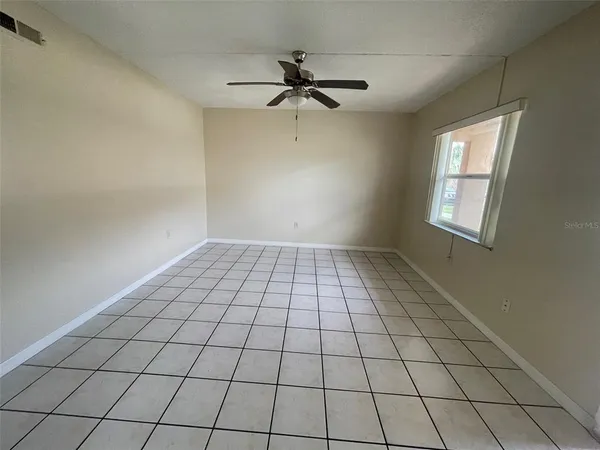 a view of an empty room and window