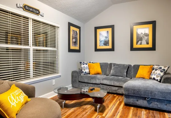 a living room with furniture and a window