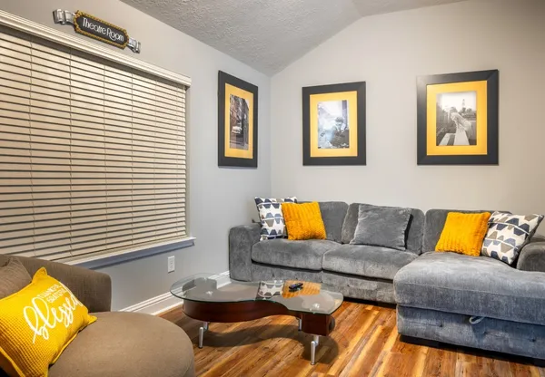 a living room with furniture and a window