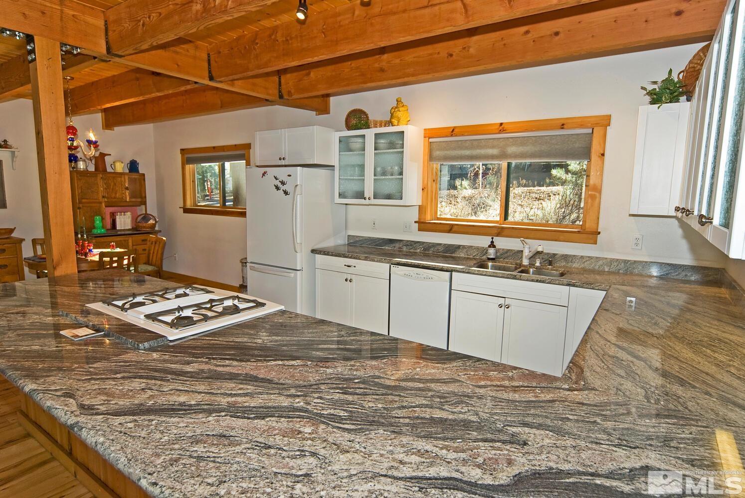 125 Pleasant Valley Road Markleeville, CA 96120 - Photo 11 of 36 a view of a kitchen with a sink storage and utility
