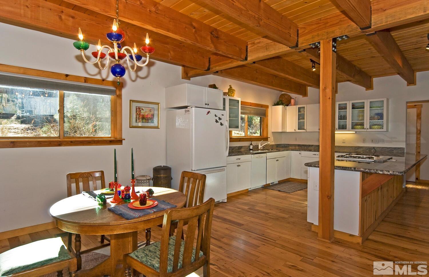 125 Pleasant Valley Road Markleeville, CA 96120 - Photo 13 of 36 a view of a very nice looking dining room with a table and chairs