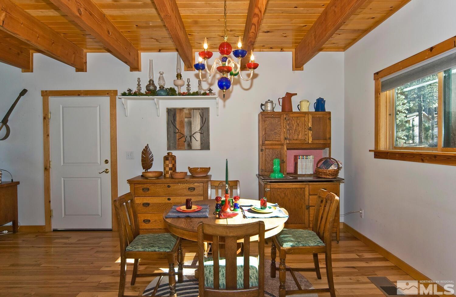 125 Pleasant Valley Road Markleeville, CA 96120 - Photo 14 of 36 a view of a dining room with furniture and wooden floor