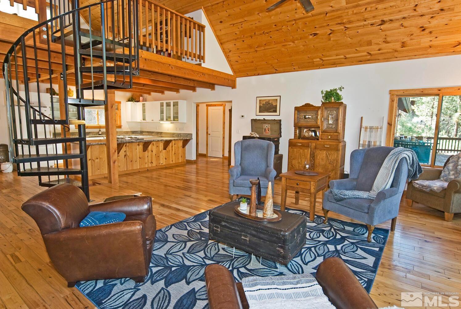 125 Pleasant Valley Road Markleeville, CA 96120 - Photo 18 of 36 a living room with furniture a dining table and wooden floor
