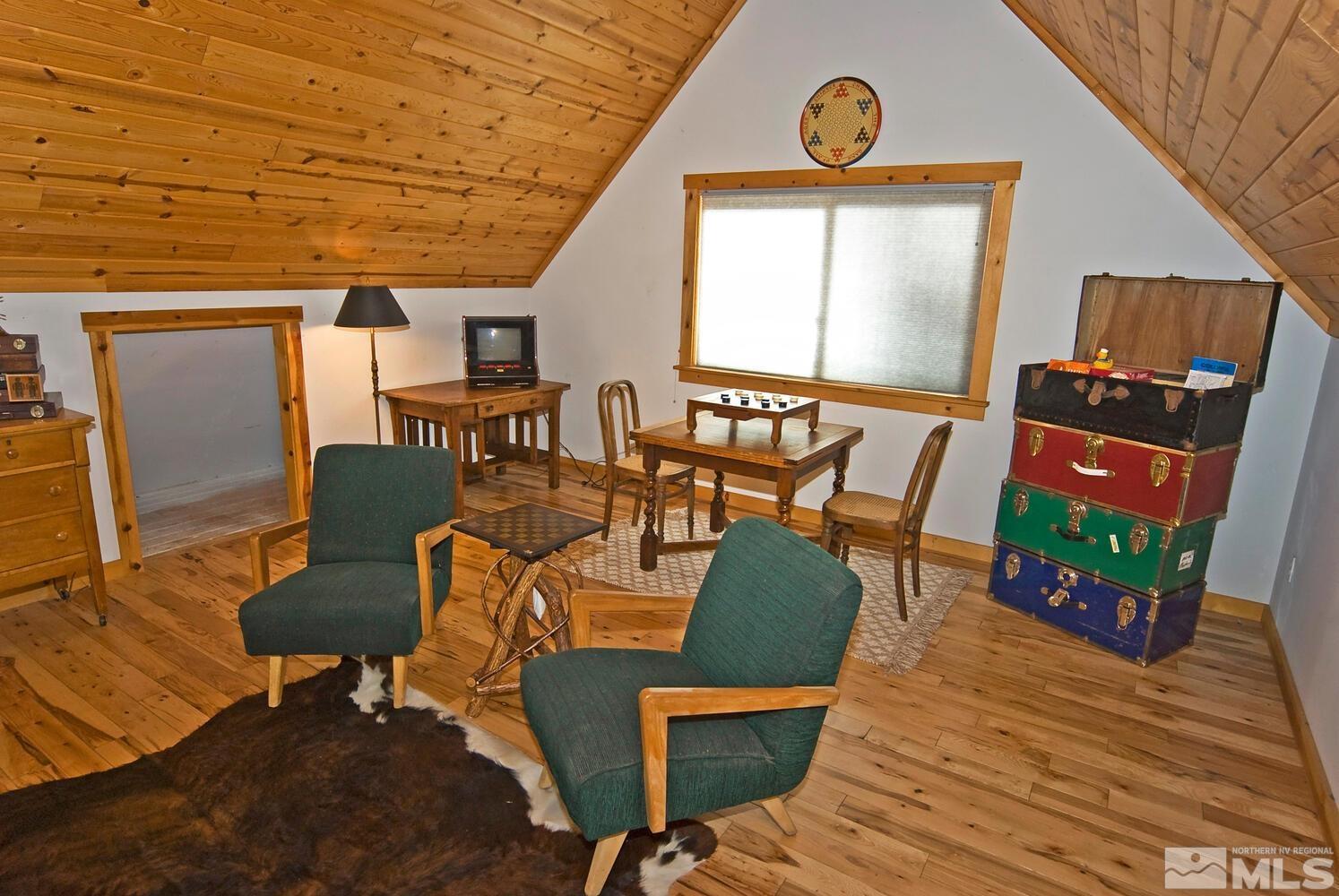 125 Pleasant Valley Road Markleeville, CA 96120 - Photo 22 of 36 a view of a dining room with furniture and wooden floor