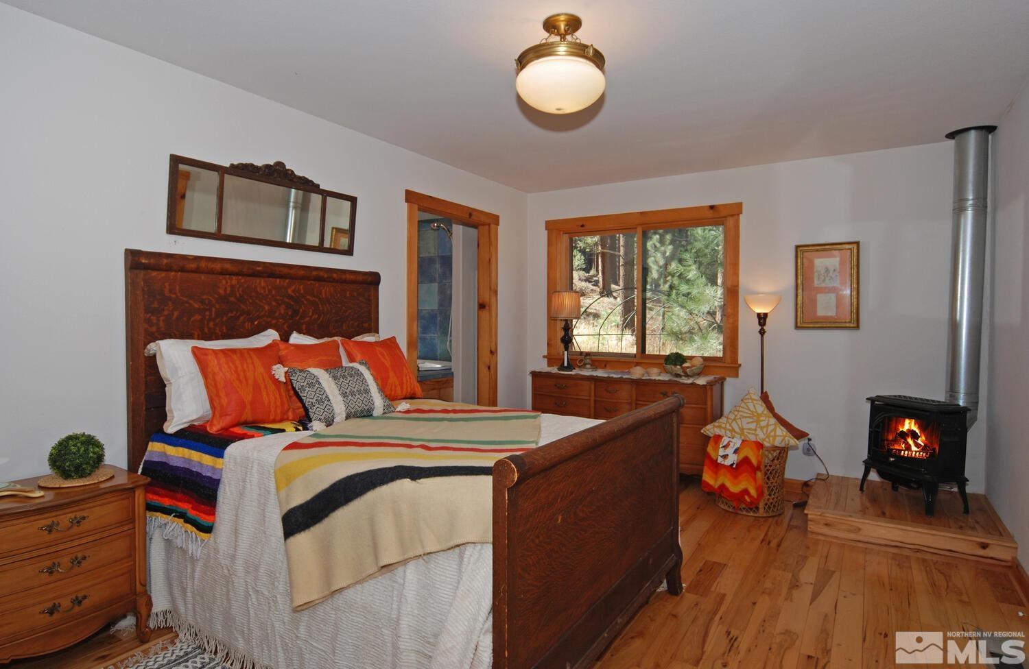 125 Pleasant Valley Road Markleeville, CA 96120 - Photo 24 of 36 a bed room with a bed and a tv