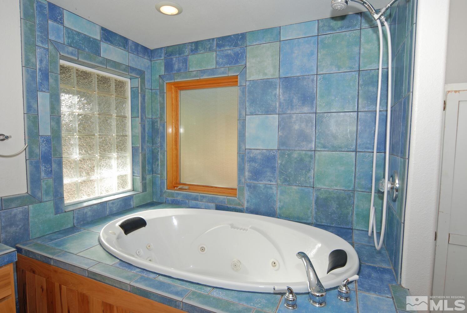 125 Pleasant Valley Road Markleeville, CA 96120 - Photo 25 of 36 a bathroom with a tub and shower