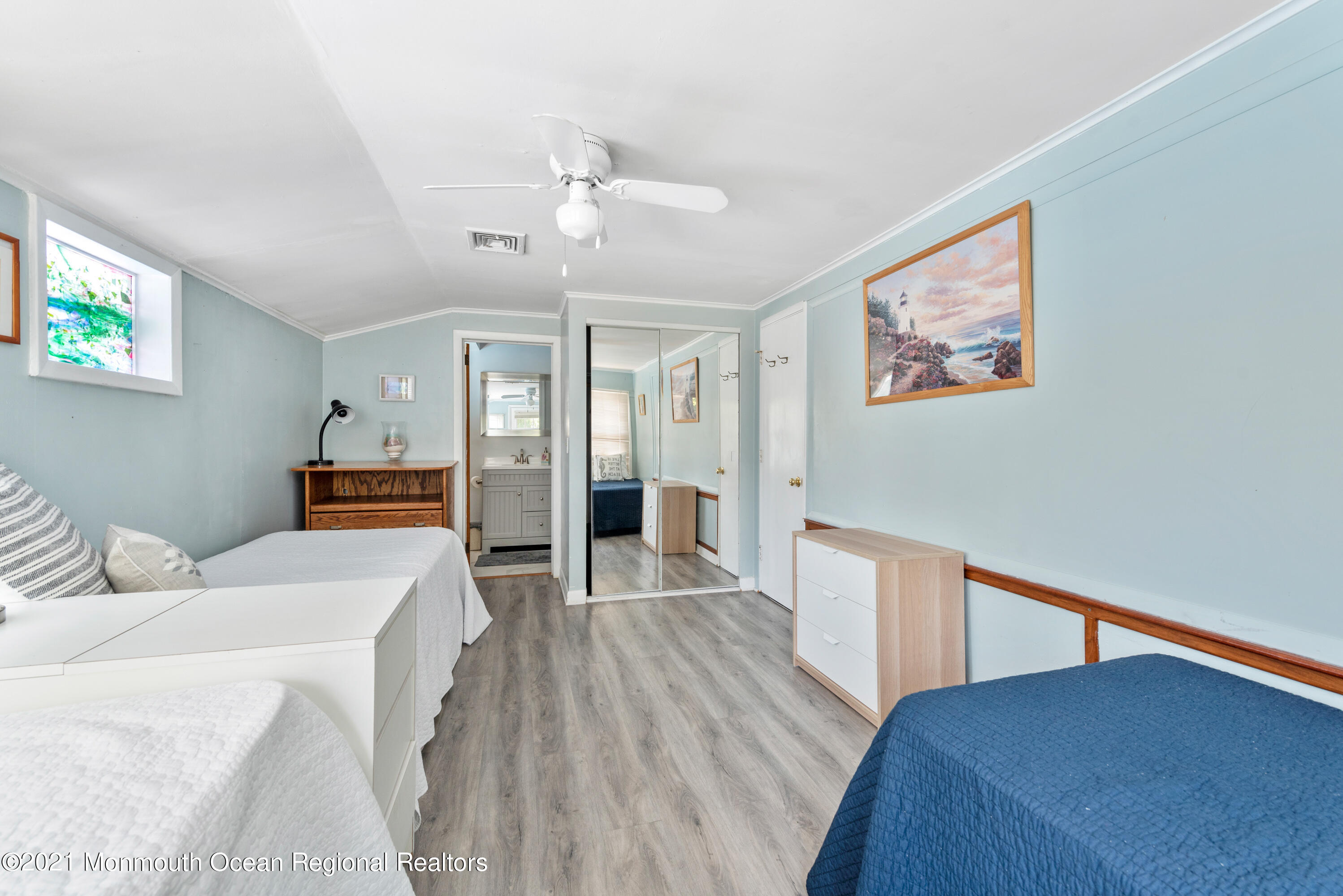 1709 Brighton Lane, Unit WINTER 2324 Spring Lake, NJ 07762 - Photo 16 of 27 a bedroom with a bed and wooden floor