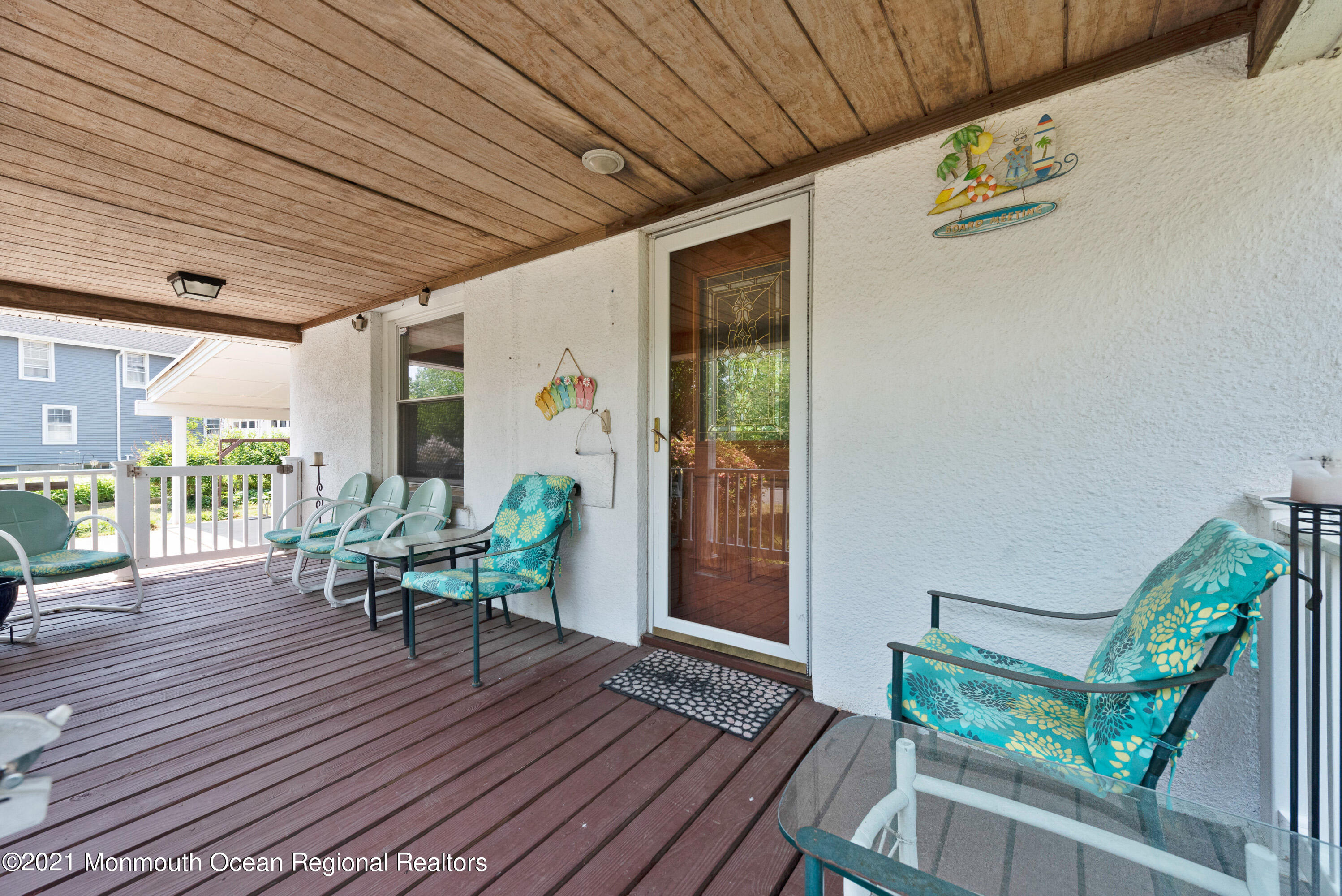 1709 Brighton Lane, Unit WINTER 2324 Spring Lake, NJ 07762 - Photo 2 of 27 a balcony with chairs and wooden floor