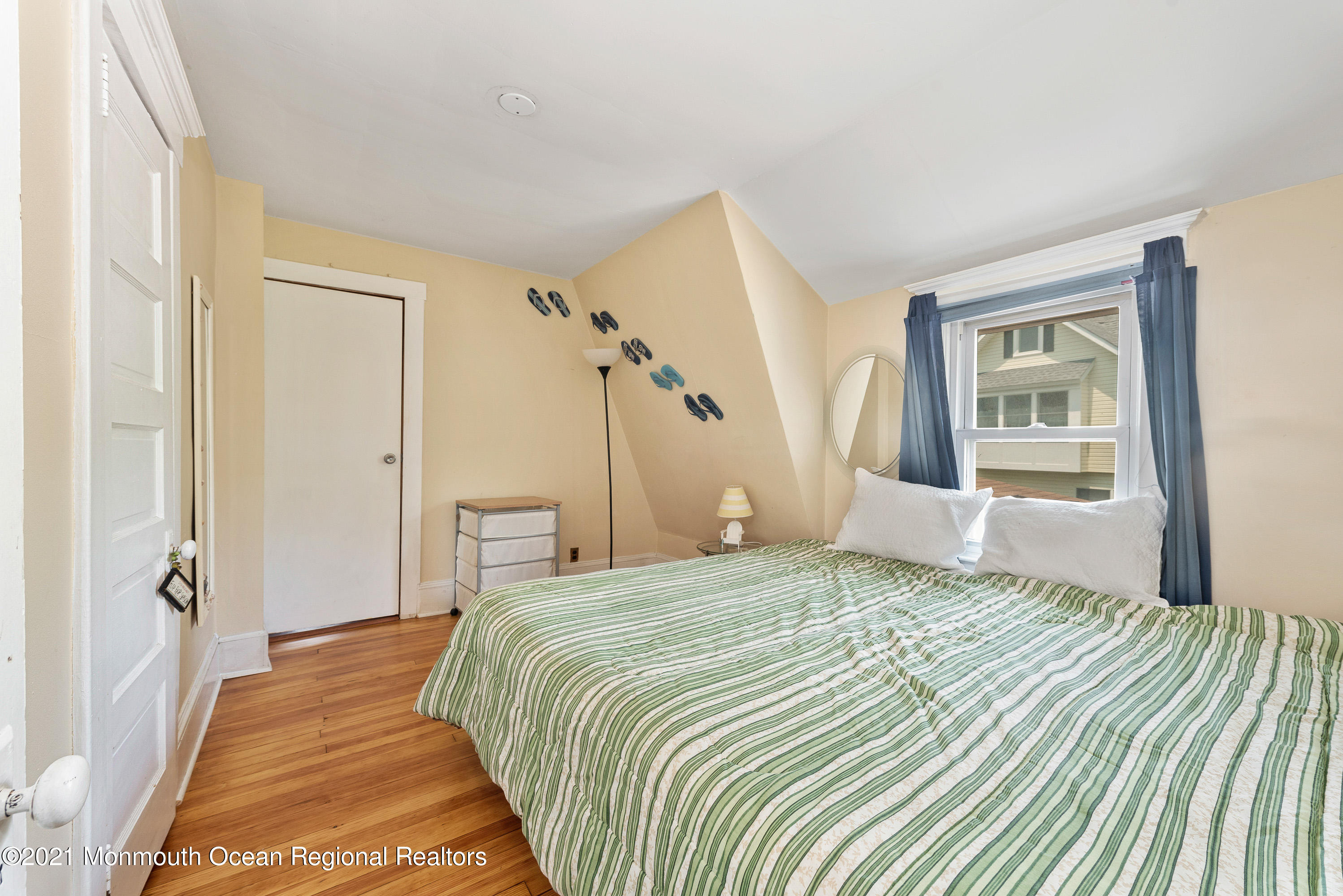 1709 Brighton Lane, Unit WINTER 2324 Spring Lake, NJ 07762 - Photo 22 of 27 a bedroom with a bed and a window