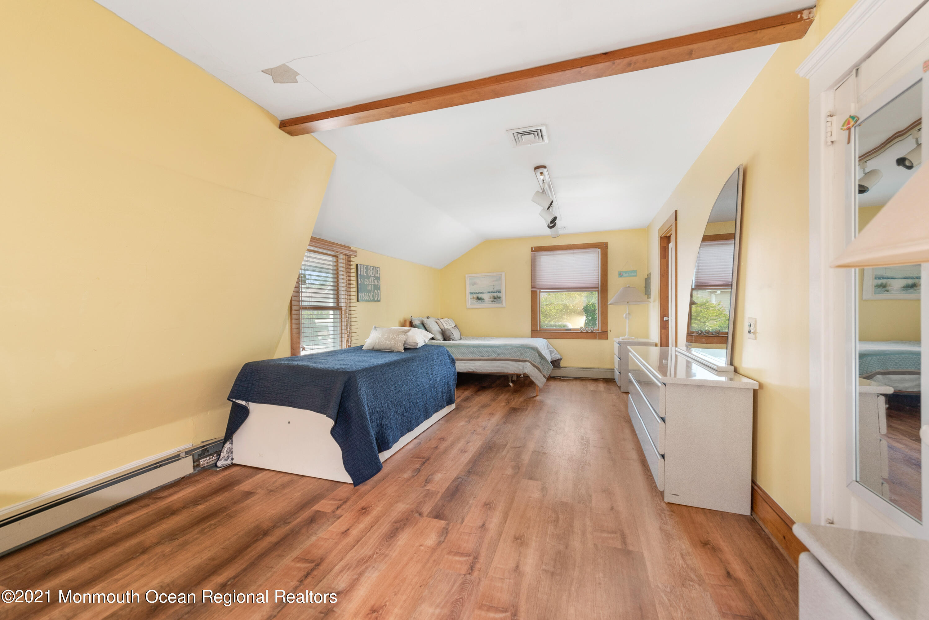 1709 Brighton Lane, Unit WINTER 2324 Spring Lake, NJ 07762 - Photo 23 of 27 a living room with furniture and a large window