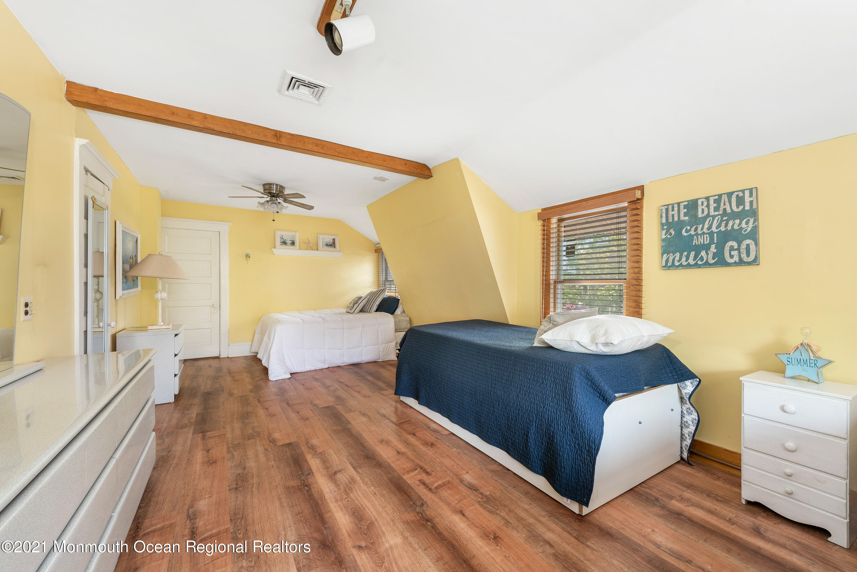1709 Brighton Lane, Unit WINTER 2324 Spring Lake, NJ 07762 - Photo 24 of 27 a bedroom with a bed and wooden floor
