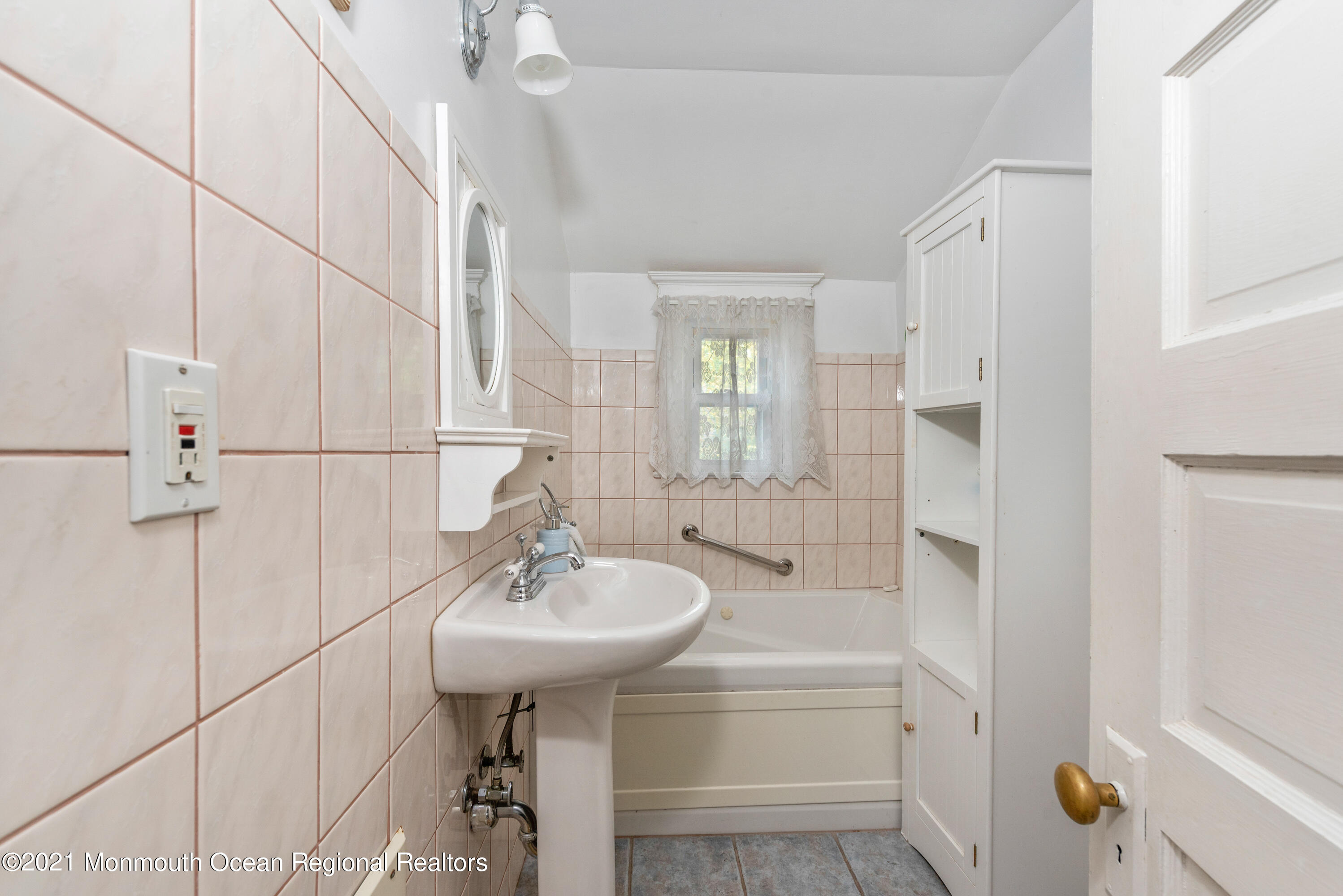 1709 Brighton Lane, Unit WINTER 2324 Spring Lake, NJ 07762 - Photo 25 of 27 a bathroom with a sink a toilet and shower