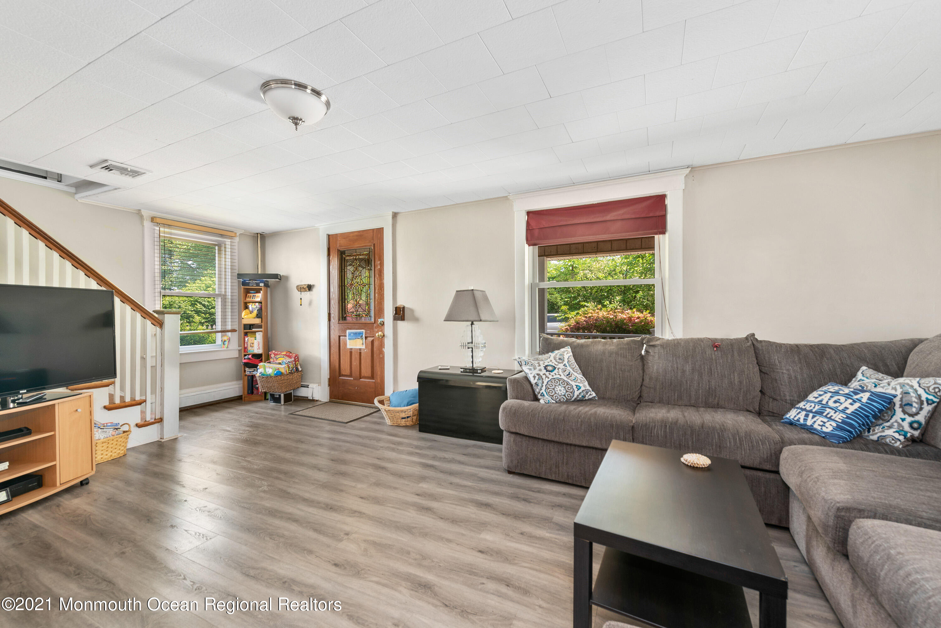1709 Brighton Lane, Unit WINTER 2324 Spring Lake, NJ 07762 - Photo 7 of 27 a living room with furniture and a flat screen tv