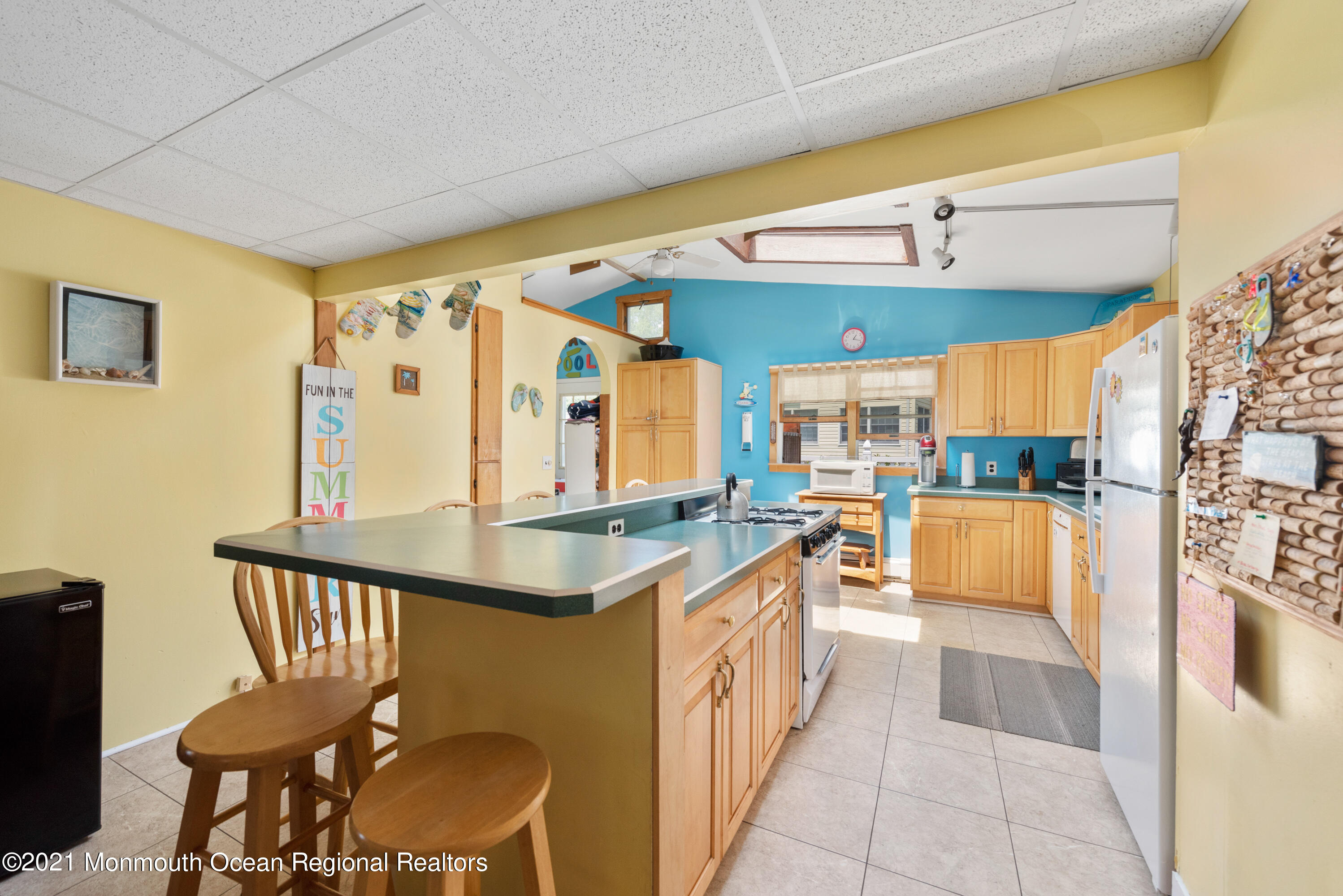 1709 Brighton Lane, Unit WINTER 2324 Spring Lake, NJ 07762 - Photo 8 of 27 a kitchen with stainless steel appliances granite countertop a sink and a refrigerator