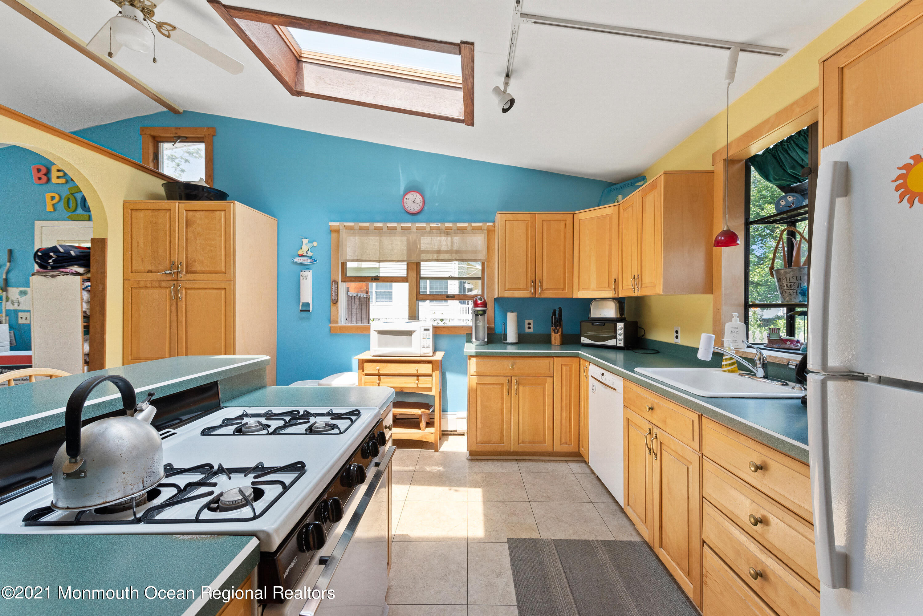 1709 Brighton Lane, Unit WINTER 2324 Spring Lake, NJ 07762 - Photo 9 of 27 a kitchen with stainless steel appliances granite countertop a sink stove and refrigerator
