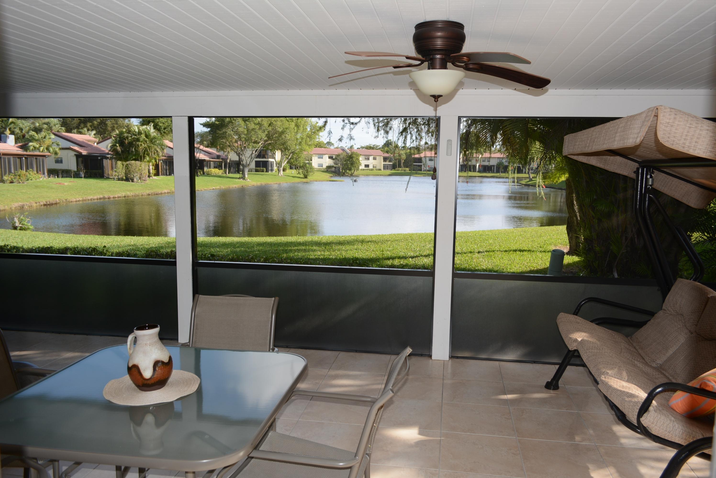 21945 Arriba Real, Unit 21B Boca Raton, FL 33433 - Photo 22 of 30 Lake View from Screened Porch