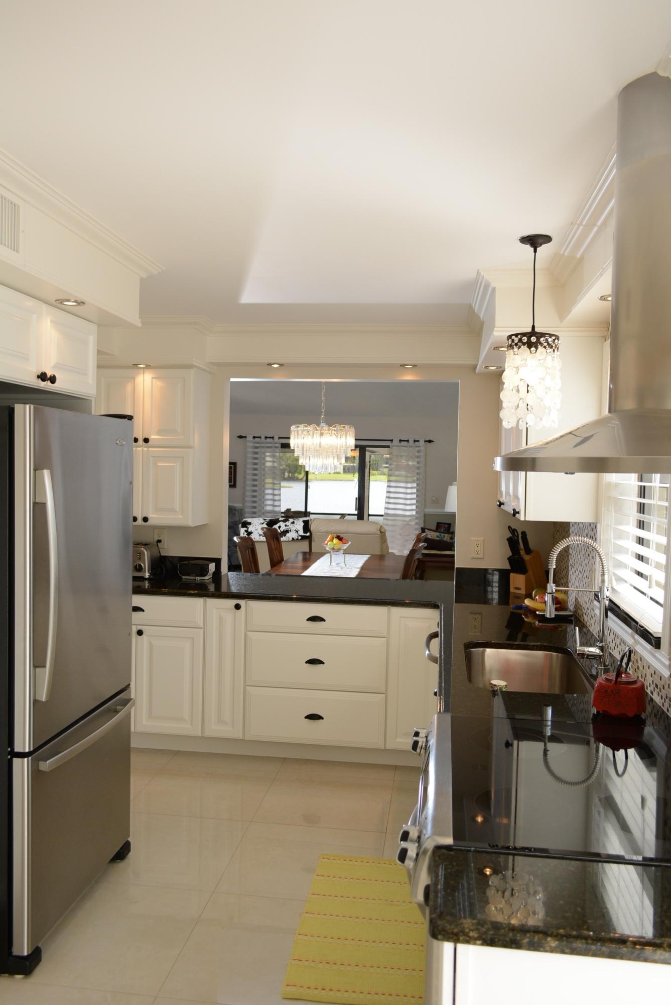 21945 Arriba Real, Unit 21B Boca Raton, FL 33433 - Photo 6 of 30 Kitchen and Pass Through