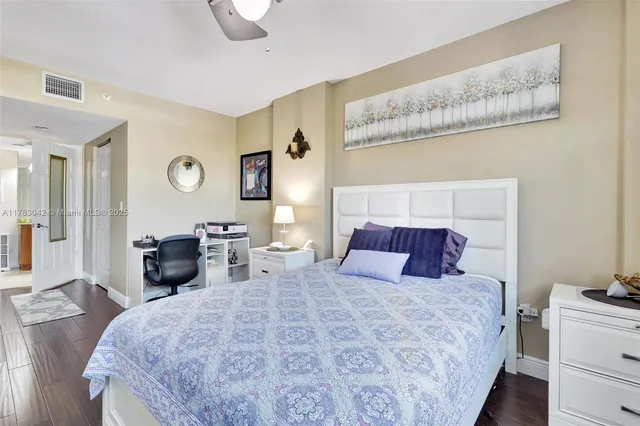 a bedroom with a large bed and a couch